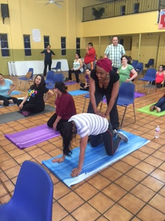 Dallas childbirth classes taught by Freya Morani yoga mat demonstration for natural childbirth education in Dallas TX RootMama