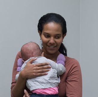 Dallas Childbirth Classes at Rootmama participant with her baby Ethiopian mothers in dallas desiring natural birth